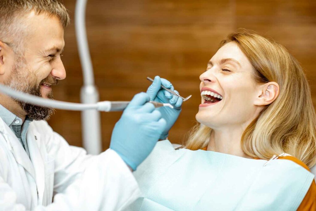 adult patient with dentist smiling